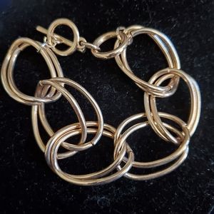 Goldtone double link bold chain bracelet with toggle closure